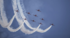 Royal Air Force Red Arrows performing maneuvers in the sky